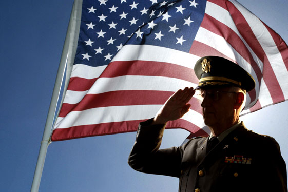 veteran-saluting-in-front-of-flag