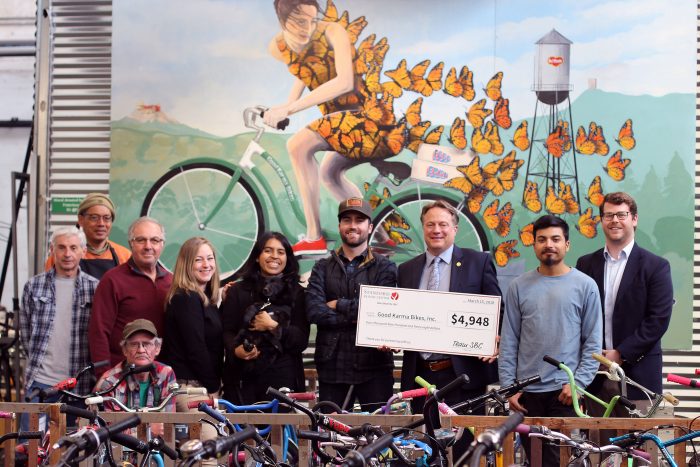 Good Karma Bikes Group with check