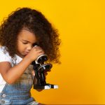 little girl with microscope