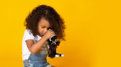 little girl with microscope